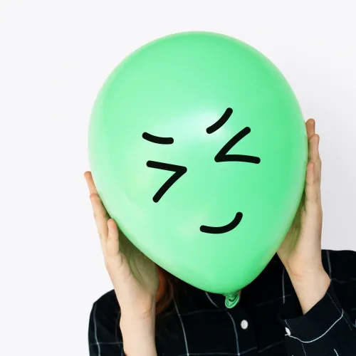 People Faces Covered with Happy Expression Emotion Balloons